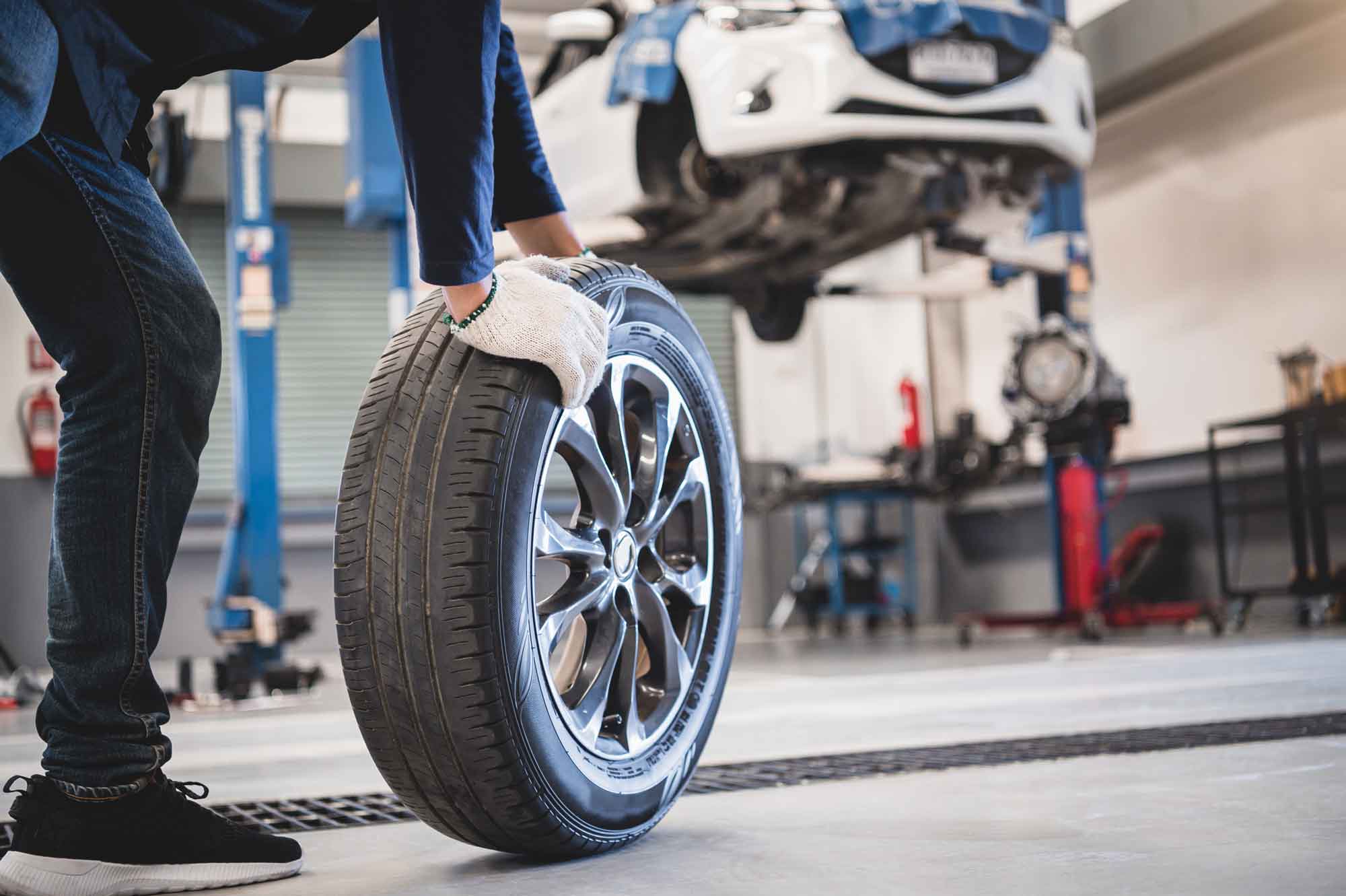 Mechanic pushing wheel